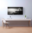Panorama Wandbild: Zeitloser Leuchtturm an einem ruhigen Meer - posterfolio.de