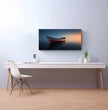 Panorama Wandbild: Einsames Boot im Sonnenuntergang - posterfolio.de