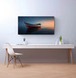 Panorama Wandbild: Einsames Boot im Sonnenuntergang - posterfolio.de