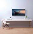 Panorama Wandbild: Einsames Boot im Sonnenuntergang - posterfolio.de