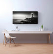 Panorama Wandbild: Zeitloser Leuchtturm an einem ruhigen Meer - posterfolio.de